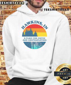 Retro hoodie featuring 'Top Hawkins' design, perfect for coffee and contemplation lovers in a cozy setting.