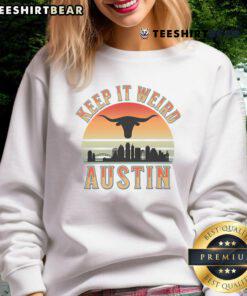 Vintage sunset sweatshirt featuring 'Keep It Weird Austin' design, perfect for stylish comfort and Austin pride.