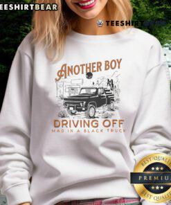 Boy in a black sweatshirt driving a truck madly, showcasing fun and excitement in an adventurous scene.