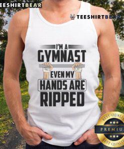 Gymnast in a stylish ripped tank top showcasing strength and flexibility, embodying the spirit of gymnastics.