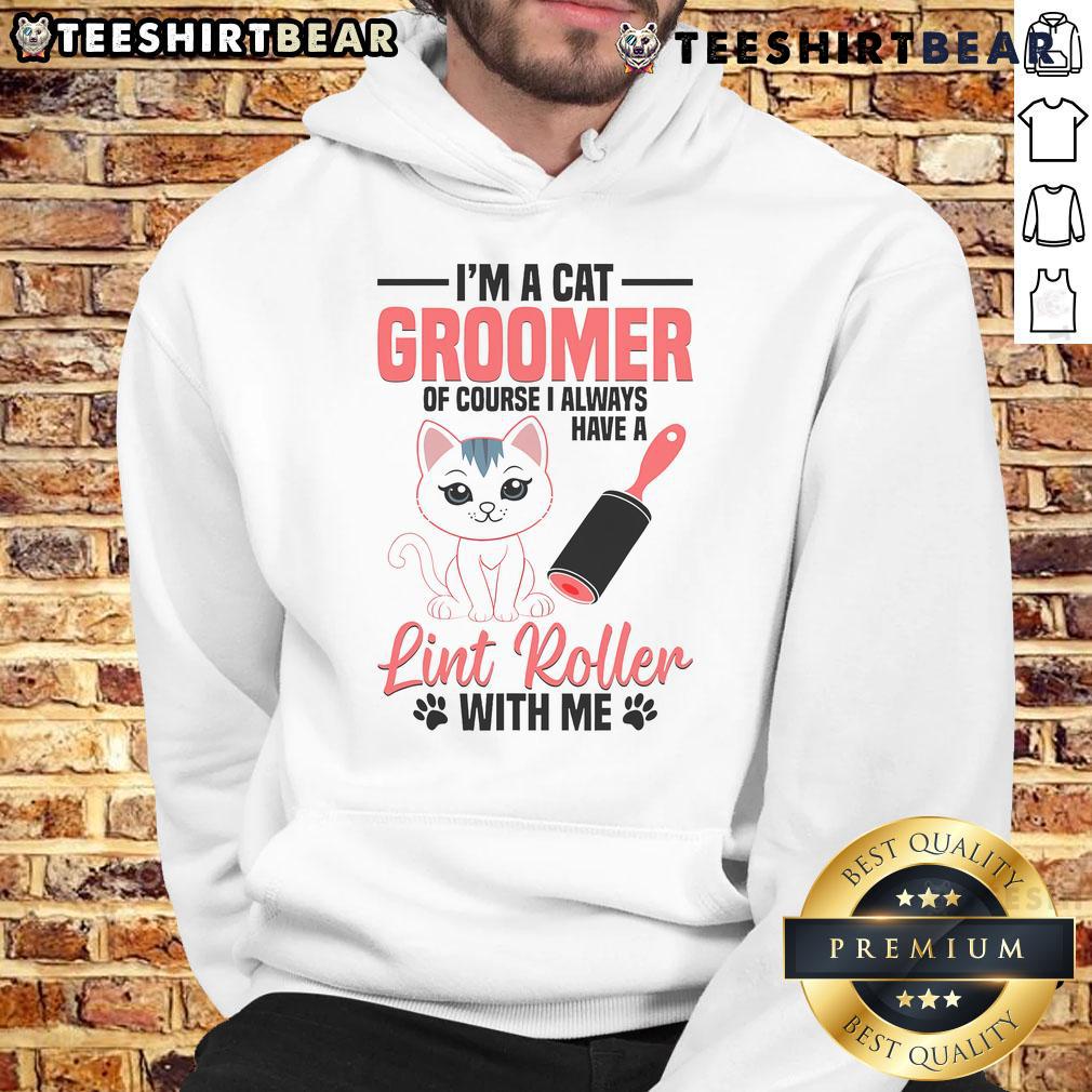 Cute cat groomer wearing a stylish hoodie, gently washing a kitten, showcasing pet grooming expertise and care.