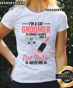 Alt Text: Cute cat groomer in a stylish tee, washing a kitten, perfect for pet lovers and cat grooming enthusiasts.