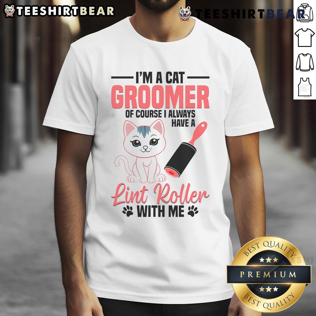 Cute cat groomer kitten styling a fluffy cat, showcasing a pet washing t-shirt for pet grooming enthusiasts.