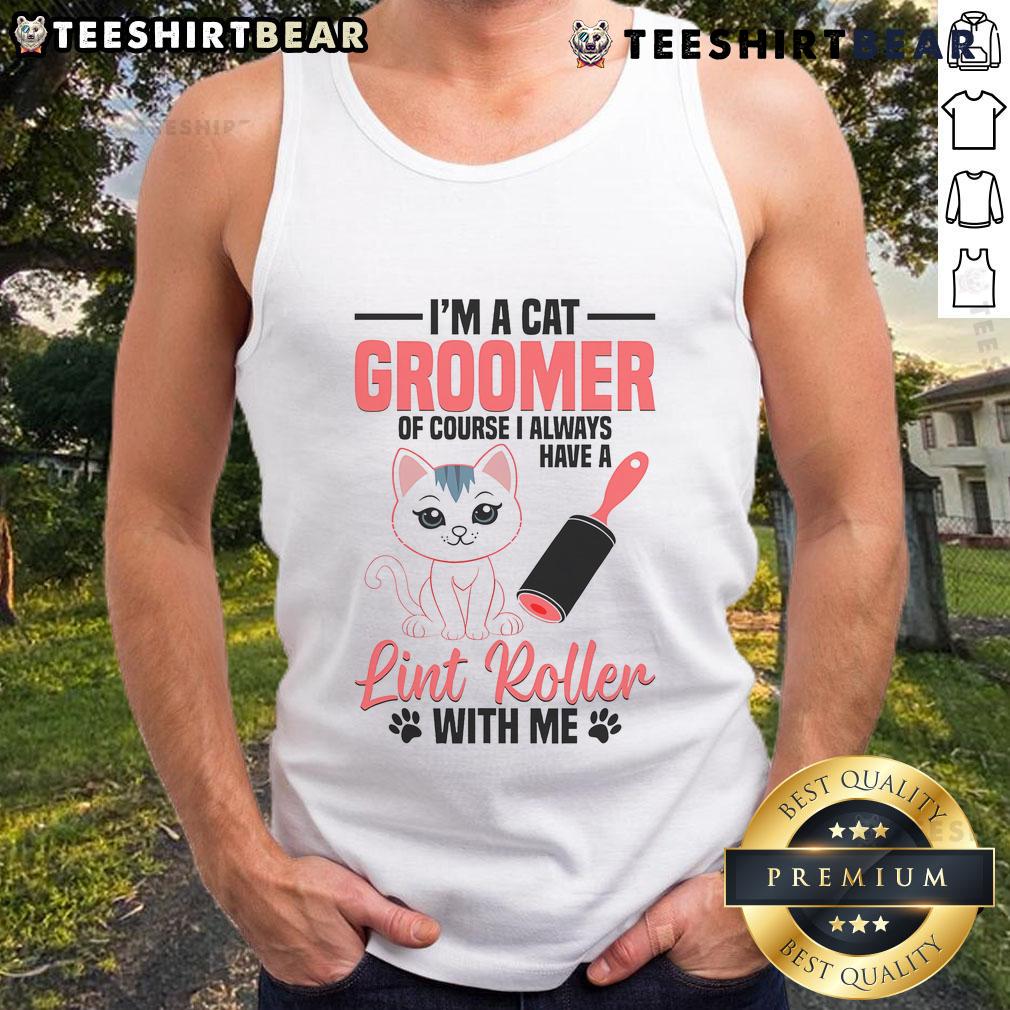 Cute cat groomer wearing a tank top, grooming a kitten in a pet washing station, showcasing cat stylist skills.