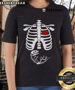 Funny pregnant woman wearing a dinosaur skeleton Halloween costume on a ladies tee, perfect for Halloween celebrations.