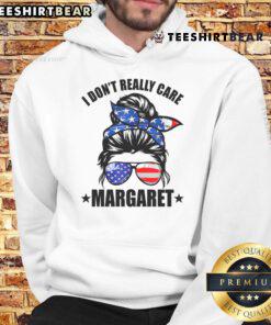 Margaret wearing a 'Good I Dont Really Care' hoodie in a messy bun, showcasing minimalist style and JD Vance inspiration.