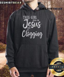 Girl wearing a 'This Girl Runs on Jesus and Clogging' hoodie, showcasing her love for faith and dance.
