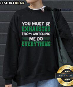 Cozy 'Good You Must Be Exhausted From Watching Me Do Everything' sweatshirt in soft fabric, perfect for casual wear.