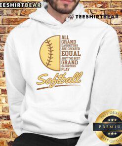 Joyful grandparent wearing a 'My Granddaughter Plays Softball' hoodie, celebrating at a softball game.