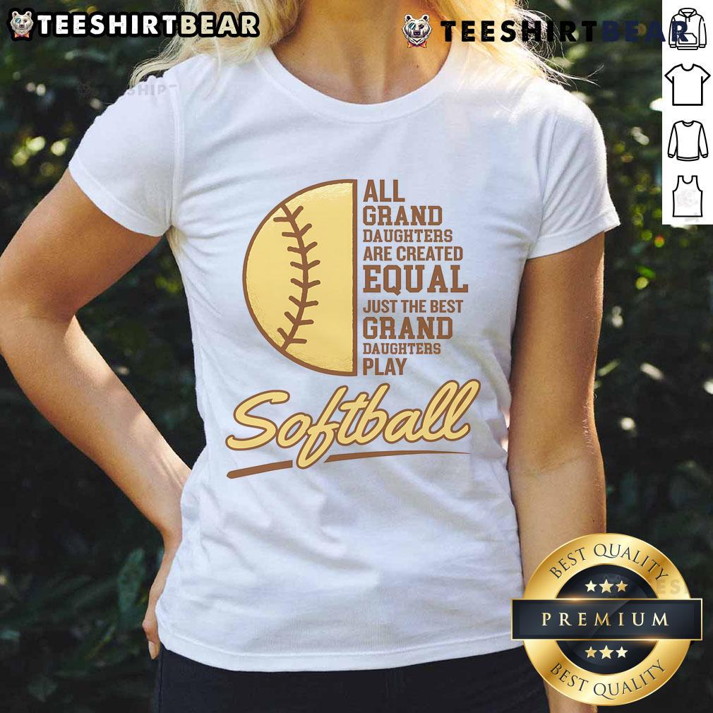 Happy grandparent cheering at a softball game, proudly supporting their granddaughter playing softball in a ladies' tee.