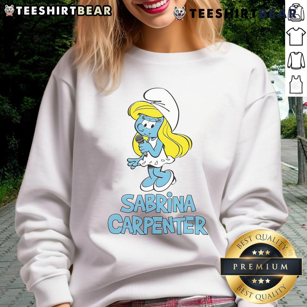 Sabrina Carpenter wearing a stylish Smurfs sweatshirt, showcasing her trendy fashion sense and vibrant personality.