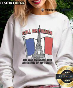 Model wearing 'Nice Call Me French' sweatshirt, showcasing stylish design and vibrant colors in urban setting.