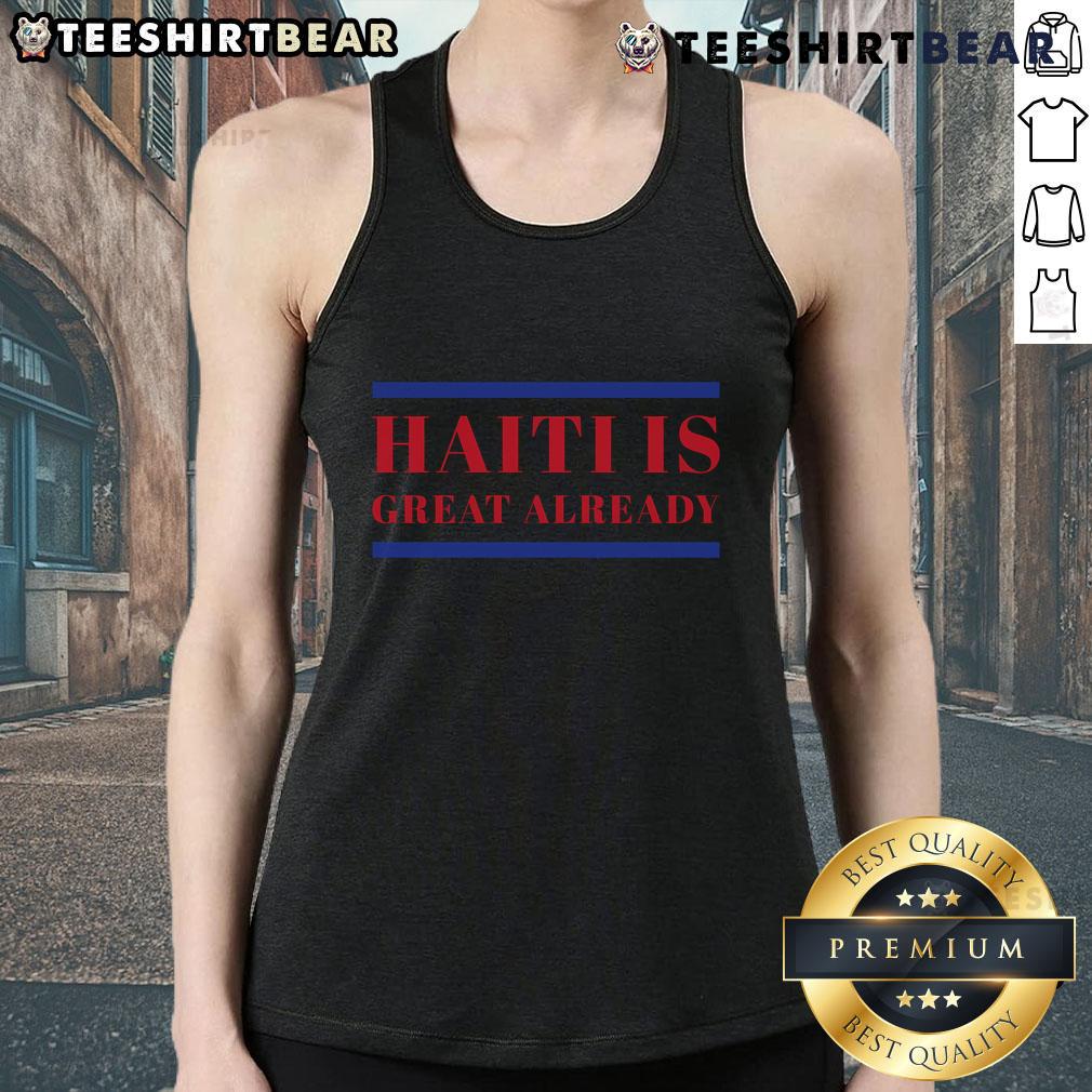 Conan O'Brien wearing a 'Haiti is great already' tank top, showcasing humor and support for Haiti in a vibrant setting.