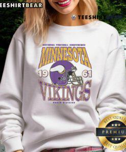 Alt Text: Classic Minnesota Vikings helmet sweatshirt featuring team colors and logo, perfect for fans and game day attire.