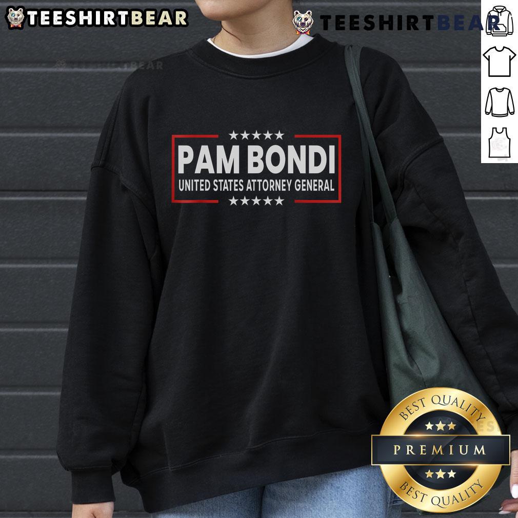 Pam Bondi wearing a United States Attorney General DOJ sweatshirt, showcasing her role in law enforcement.
