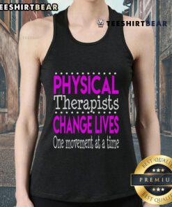 Physical therapist wearing a tank top that says 'Change Lives One Movement At A Time' during a therapy session.