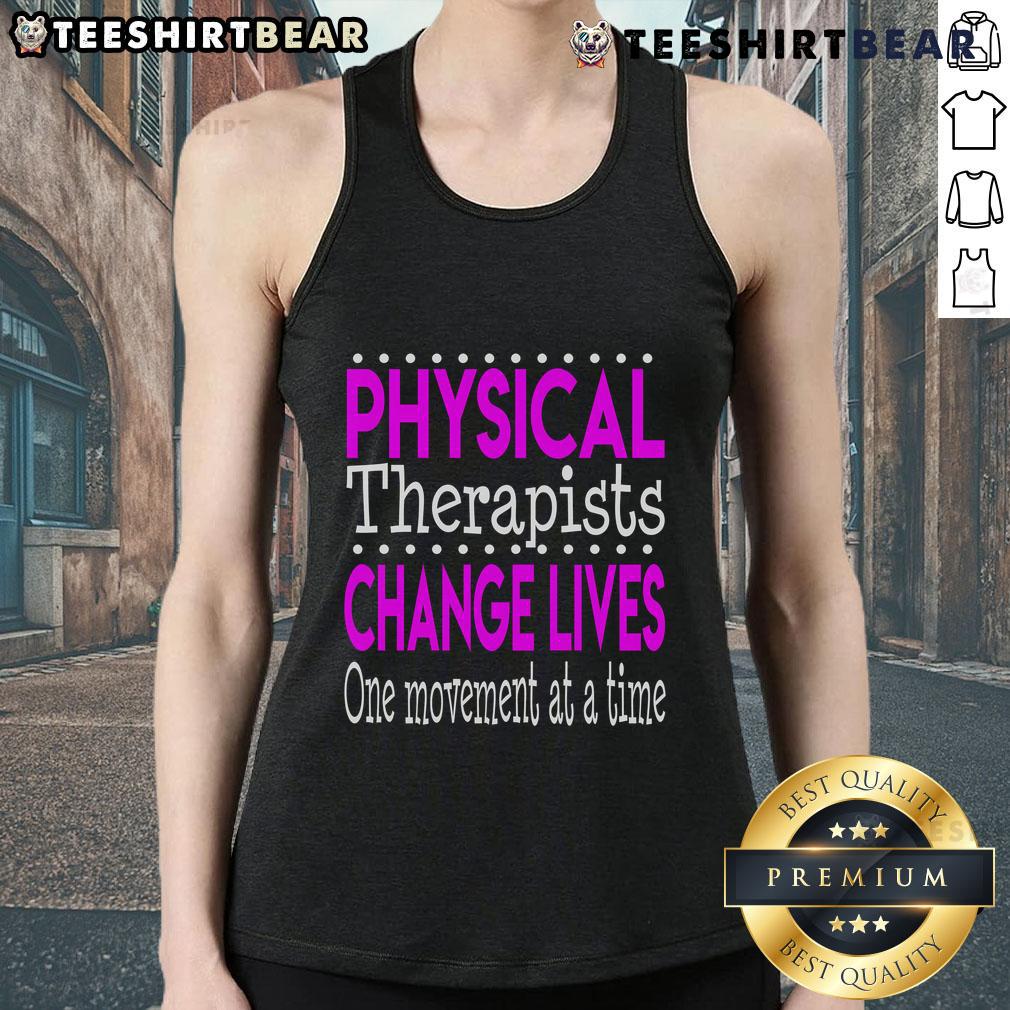 Physical therapist wearing a tank top that says 'Change Lives One Movement At A Time' during a therapy session.