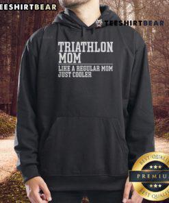 Triathlete mom in a hoodie, showcasing swim, bike, run spirit during a triathlon event, celebrating fitness and family.
