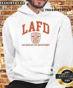 Tom Brady wearing LAFD hoodie, showing support for Los Angeles Fire Department in a casual, stylish look.
