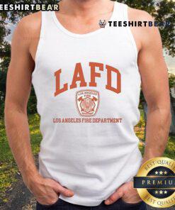 Alt Text: Tom Brady in a Los Angeles Fire Department tank top, showcasing his support for LAFD and sporty style.