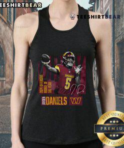 Jayden Daniels wearing a black tank top, celebrating as the 2024 NFL Offensive Rookie of the Year for the Washington Commanders.