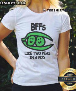 Alt Text: Two best friends wearing matching 'Top BFFs Like Two Peas In A Pod' ladies tee, showcasing their close bond and style.