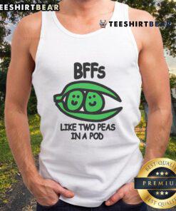 Two best friends wearing matching 'Top BFFs Like Two Peas In A Pod' tank tops, smiling and enjoying their day together.