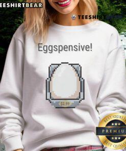 Top Eggspensive Egg 8-bit retro pixel sweatshirt featuring colorful pixel art design and playful egg graphics.