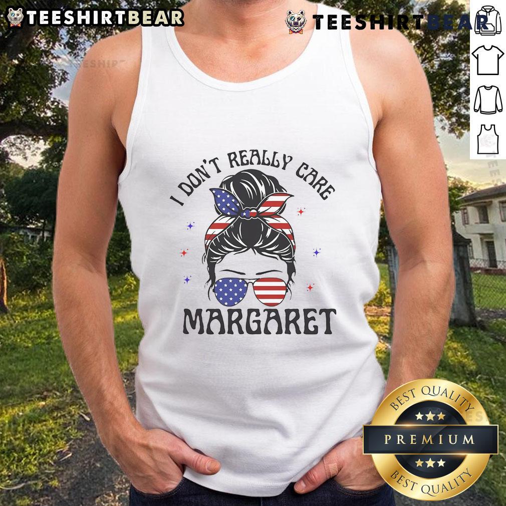Stylish 'I Don't Really Care' tank top featuring Margaret in a messy bun, perfect for casual summer outfits.