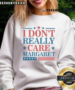 Minimalist US flag sweatshirt featuring 'I Don't Really Care' by Margaret, perfect for casual, stylish outfits.