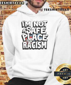 Person wearing a 'Not A Safe Place For Racism' hoodie, promoting anti-racism awareness and social justice.