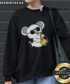 Top koala playing saxophone as a band member on a colorful sweatshirt, perfect for music lovers and wildlife enthusiasts.