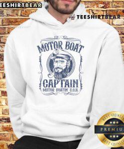 Top motor boat captain wearing a hoodie while enjoying pontoon boating on a scenic lake.