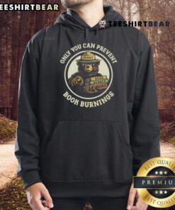 Alt Text: Sparky Bear hoodie with 'Only You Can Prevent Book Burnings' slogan promoting reading banned books.