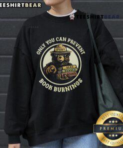 Cozy Sparky Bear sweatshirt featuring 'Only You Can Prevent Book Burnings' and 'Read Banned Books' slogan.