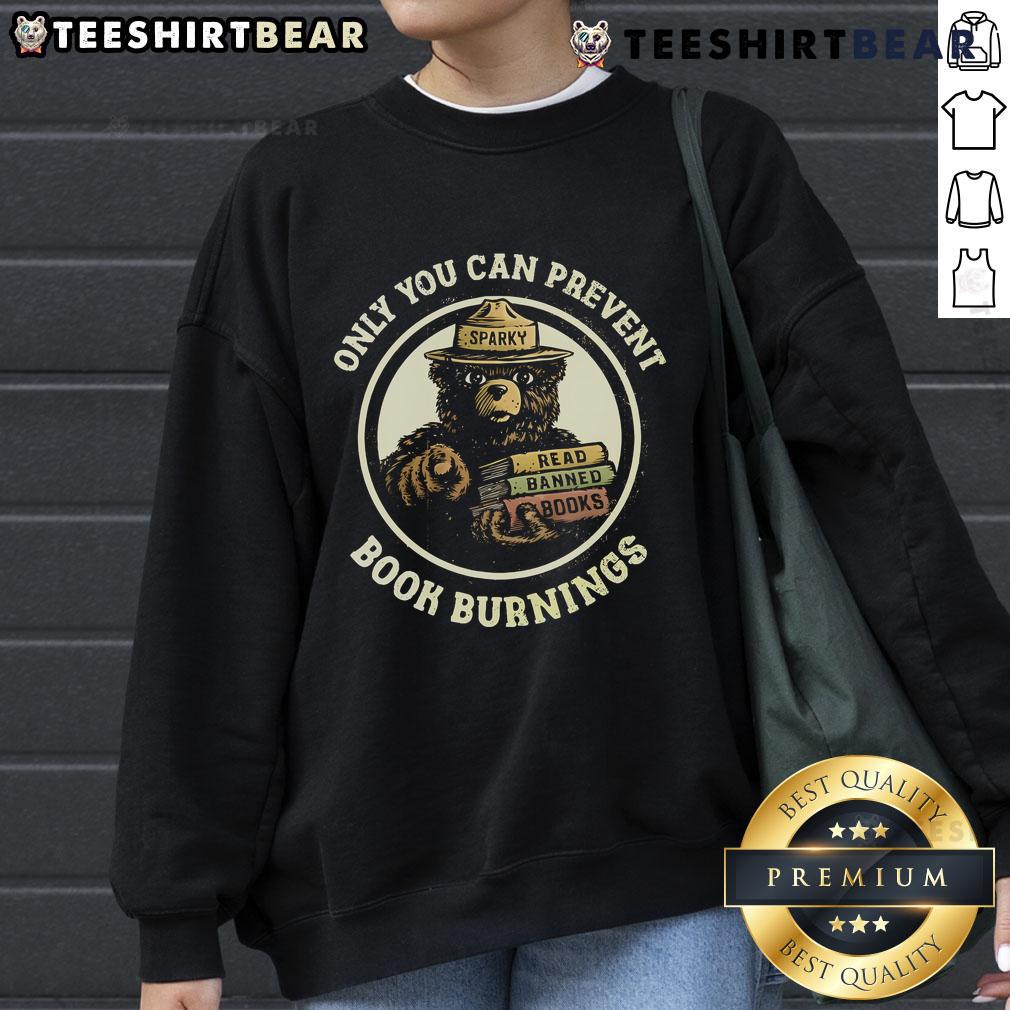 Cozy Sparky Bear sweatshirt featuring 'Only You Can Prevent Book Burnings' and 'Read Banned Books' slogan.