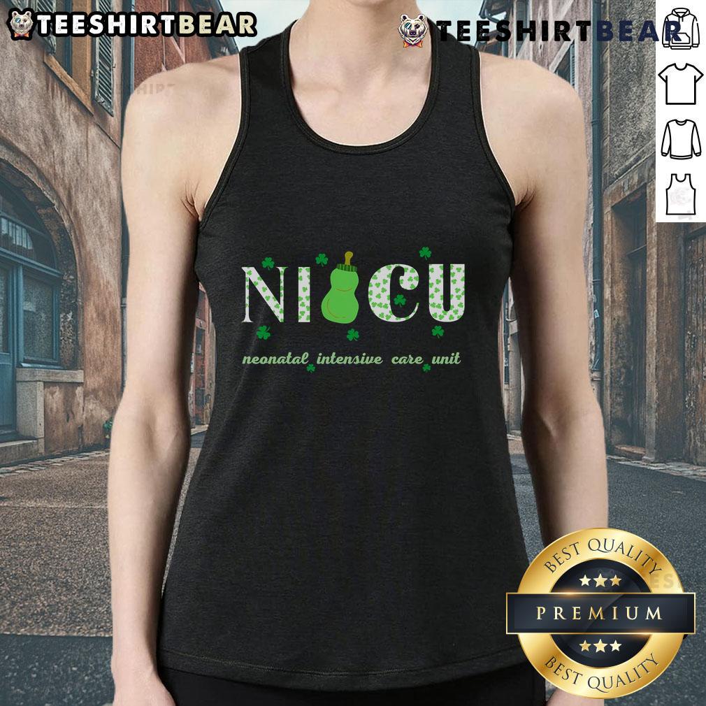 Happy NICU nurse wearing a top retro shamrock tank top for St. Patrick's Day, celebrating with festive spirit.