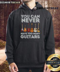 Cozy 'You Can Never Have Too Many Guitars' hoodie displayed on a wooden background, perfect for guitar enthusiasts.