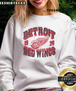 Alt Text: Stylish Detroit Red Wings rink sweatshirt featuring an arched wordmark design, perfect for hockey fans and casual wear.