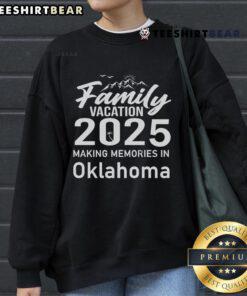 Family wearing matching 'Awesome Family Vacation 2025' sweatshirts in Oklahoma, capturing joyful memories together.