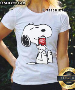 Alt Text: Cute Snoopy hugs a Dr Pepper can on a ladies tee, perfect for fans of Peanuts and vintage beverage apparel.