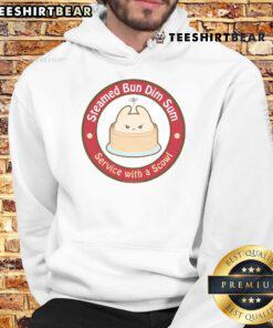 Cute steamed bun dim sum served with a playful scowl hoodie, showcasing a unique and fun dining experience.