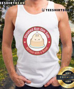 Adorable steamed bun dim sum served with a scowl tank top, showcasing a playful culinary presentation.