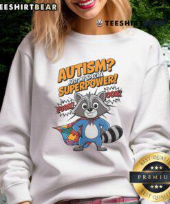 Funny autism superhero raccoon sweatshirt featuring vibrant design highlighting autism as a superpower.