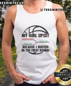 Funny image of my girl upset after I busted in the first round wearing a basketball tank top, capturing our playful moment.