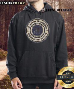Good 4 Speed Manual Transmission Preservation Society hoodie displayed on a hanger, showcasing its stylish design and logo.
