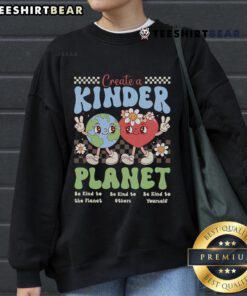 Trendy 'Good Create A Kinder Planet' sweatshirt for Earth Day, featuring a vibrant design promoting kindness and sustainability.