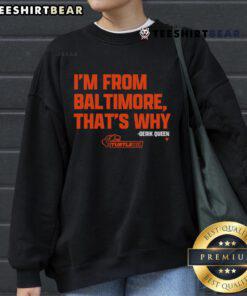 Good Derik Queen I'm From Baltimore orange sweatshirt worn by a model, showcasing stylish streetwear fashion.