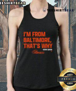 Alt Text: Good-Derik-Queen-Im-From-Baltimore wearing an orange tank top, showcasing a vibrant urban style in Baltimore.