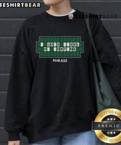 Alt Text: Cozy 'Good Wheel Lovers and Word Game of Fortune' sweatshirt featuring playful graphics for game enthusiasts.